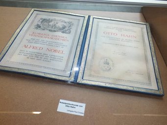 Otto Hahn’s Nobel Prize certificate. Photo Susanne Benner Nobel Prize certificate awarded to Otto Hahn displayed in a showcase.