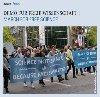 Newsletter Deckblatt 2/2017. Menschen halten Banner bei einer Wissenschafts-Demonstration.