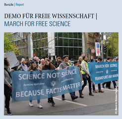 Newsletter Deckblatt 2/2017. Menschen halten Banner bei einer Wissenschafts-Demonstration.