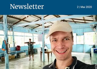 A large, open room featuring light blue wooden walls and ceiling beams, scattered furniture, and a mix of household items. Picture of the ATTO site in the brasilian rainforest.