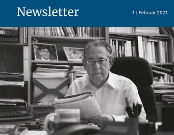 Paul Crutzen sitting at his desk holding a newspaper. black-and-white photo commemorating the death of Paul Crutzen.