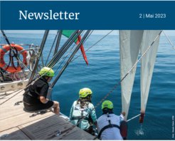 Researchers on a sailboat use specialized gear to collect marine data.