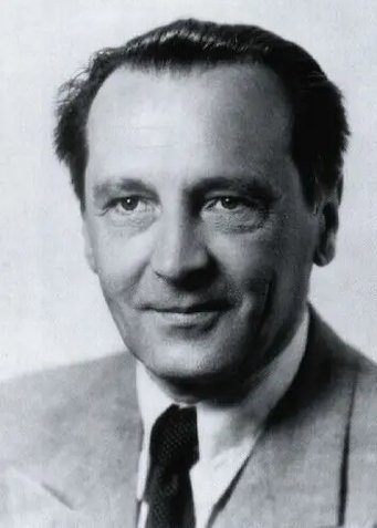 Josef Mattauch Black and white portrait of a man in a suit and tie.